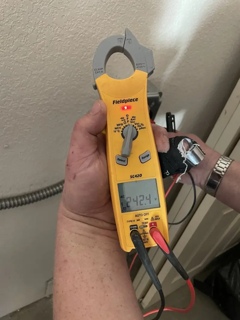 Voltage testing with clamp meter during Electrical Installation Services in Monahans